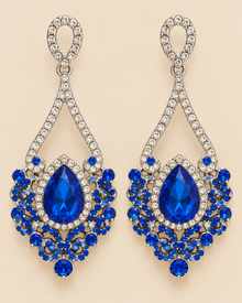 Paire de boucles AZUR bleues sur fond beige